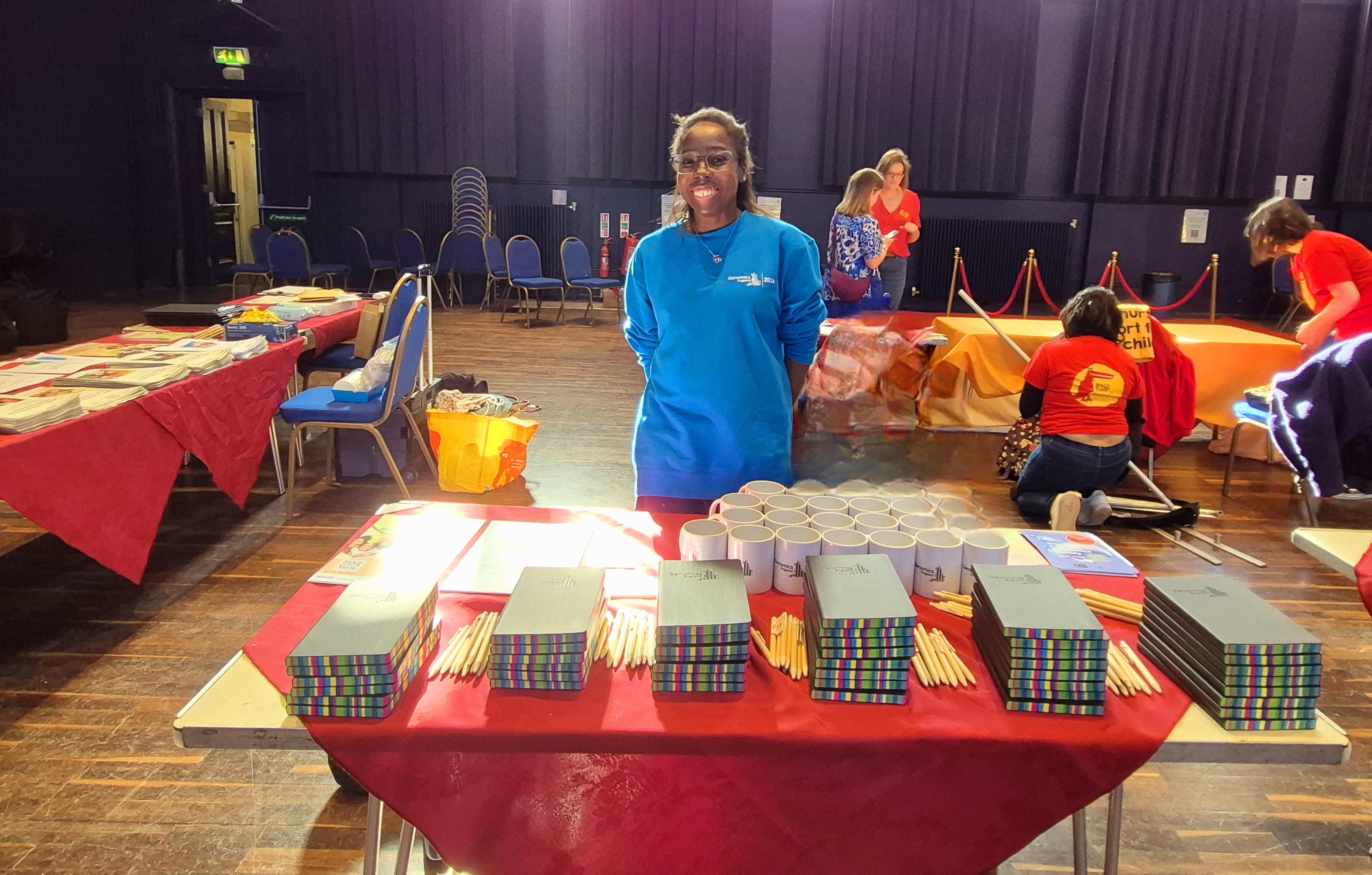 Photo of (female) Hazel Attua (Genomics England), representing the IBHO BioResource at event hosted Blackheath Halls in Lewisham, London on 8th March 2025